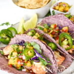 Shrimp tacos with fresh pineapple salsa on blue corn tortillas