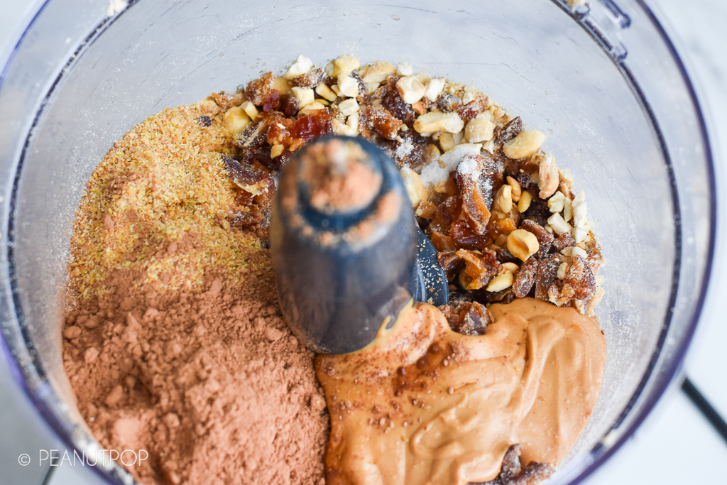 Brownie Energy Bites - Food processor step three: pulse dates, cashews, flaxseed meal, cocoa powder, salt, and vanilla together 